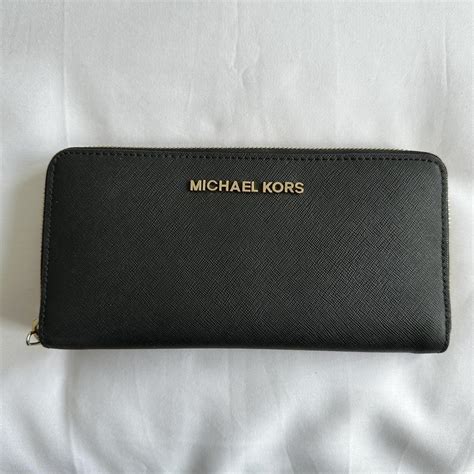 black and gold michael kors wallet|michael kors black zipper wallet.